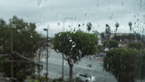 Timelapse-looking-out-a-rainy-window-on-a-stormy-day-in-Los-Angeles,-CA
