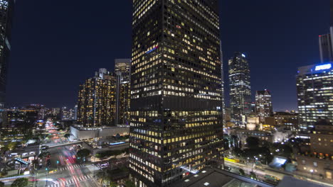Timelapse-looking-down-onto-a-busy-Downtown-Los-Angeles-street-and-hotel