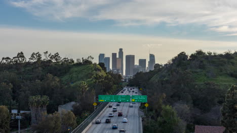 Timelapse-from-the-110-Freeway-Bridge-of-traffic-entering-Downtown-Los-Angeles-at-sunset