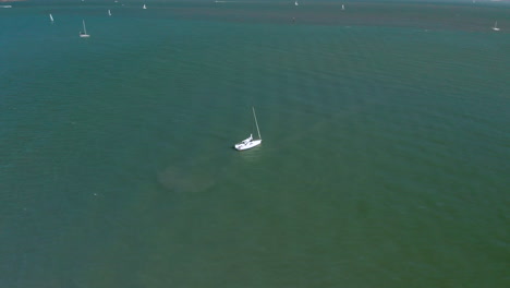 Drone-shot-of-a-boat-in-the-harbor-in-Sausalito-outside-of-San-Francisco