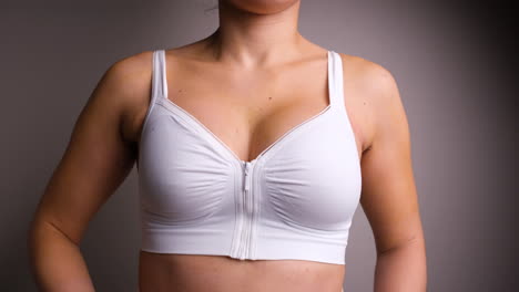 Cropped-Portrait-Of-A-Woman-With-Scar-Under-Armpit-Wearing-Breast-Augmentation-Bra-After-Surgery