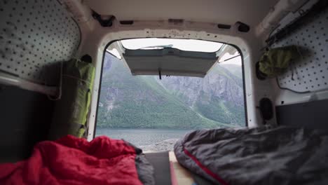 View-Of-A-Camper-Van-With-Person-Inside-The-Portable-Sleeping-Bag-Blanket