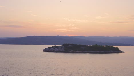 Sunrise,-sunset-over-Adriatic-sea-with-land-in-the-background