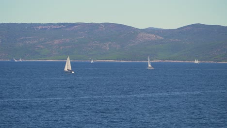 View-of-sailboats-in-Adriatic-sea-with-mountainous-coast-in-the-background