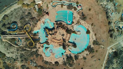 Drone-shot-of-an-abandoned-water-park