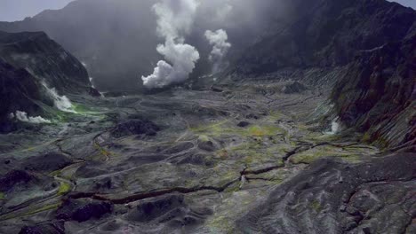White-Island-Whakaari-crater-with-toxic-smoke-and-barren-terrain,-aerial