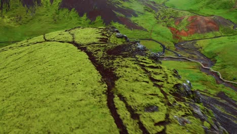 Green-Craggy-Mountains-Revealed-Natural-Hot-Spring-River-Bath-In-Reykjadalur,-Iceland