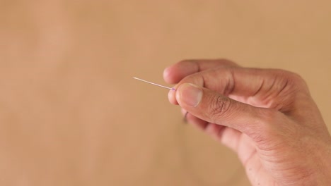 Thread-a-beading-needle.-Handmade-crafts