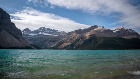 Time-Lapse,-Bow-Lake-Alpine-Water-and-Clouds-Above-Snow-Capped-Hills-of-Canadian-Rockies-on-Sunny-Autumn-Day