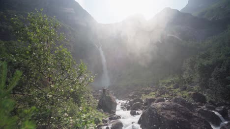 Majestic-Mountains-With-Mardalsfossen-Waterfall-Backlit-Sunlight-In-Møre-og-Romsdal-County,-Norway
