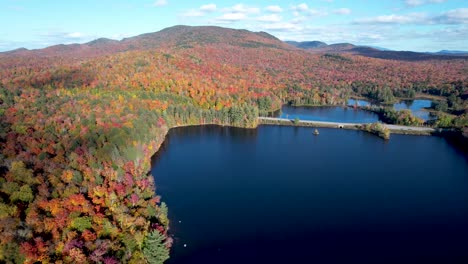 Aerial-view-of-New-Update-New-York-lake-in-mountains-with-changing-fall-leaves