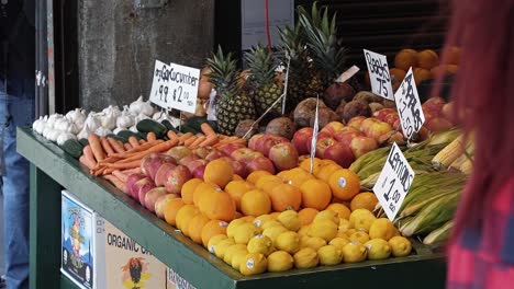 A-colorful-table-of-fruit-and-vegetables-for-sale-in-the-famous-Pike-Place-farmers-market-in-the-middle-of-Seattle,-Washington