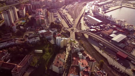Aerial-view-above-shining-Vigo-north-spain-busy-city-life-motorway-traffic-downtown-district-below