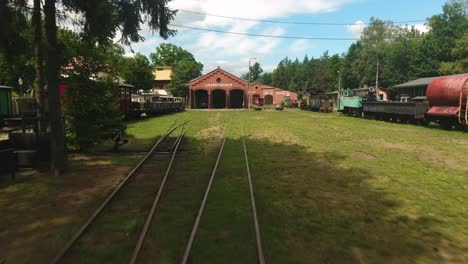 Dynamic-drone-shot-of-an-old-train-station