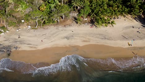 Aerial-panning-drone-clip-of-a-beach-in-Sayulita,-Nayarit,-Mexico