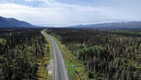 Aerial-view-of-Cars-driving-down-road-in-Alaskan-Interior
