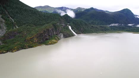 Aerial-View-of-Alaskan-waterfall-from-distance--Nugget-Falls