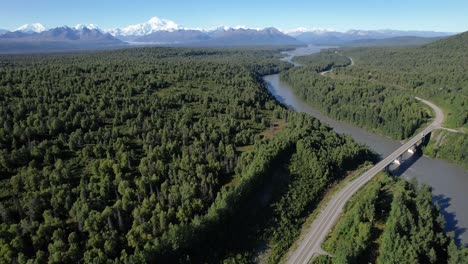 Aerial-view-of-George-Parks-highway-and-Chulitna-river-with-Denali-Mountain