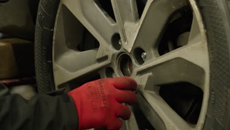 Super-close-up-of-wheel-that-is-fitted-by-inserting-its-bolts