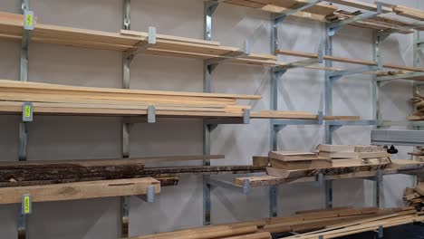 Warehouse-storage-Of-Wood-with-different-types-of-timber,-Sawn-lumber-Boards-on-shelves