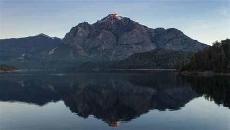 Time-lapse-of-mirrored-Lake-Moreno-highlighting-Cerro-Lopez