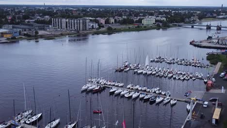 Aerial-from-yacht-club-with-sailing-boats-at-dock-with-a-background-view-on-Pärnu-town-in-Estonia