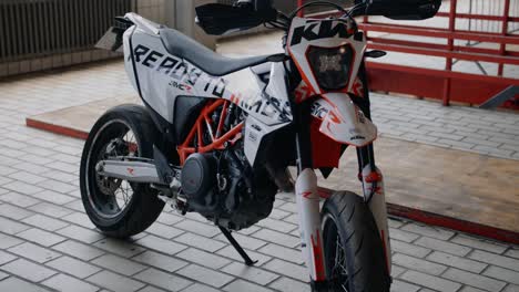 A-panning-and-tilting-parallax-shot-of-a-KTM-Supermoto-in-an-industrial-environment