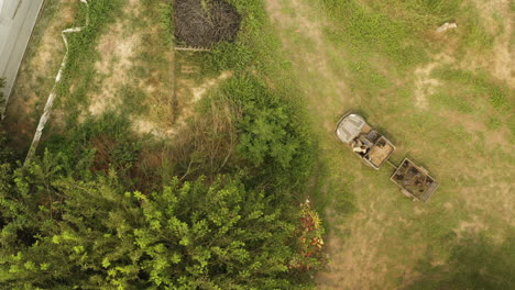 Above-view-of-an-utv-Utility-task-vehicle-working-on-a-farm-and-towing-a-trailer