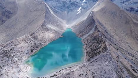 Aerial-View-Of-Humantay-Lake,-or-Laguna-Humantay-In-Andes-Mountain-Range-In-Peru