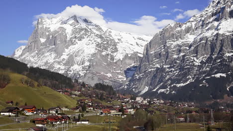 Beauty-of-Switzerland-alps,-Grindelwald-village-in-front-of-huge-mountains