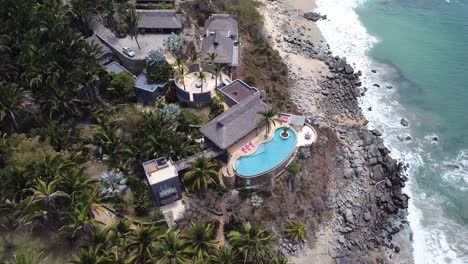 Aerial-drone-of-a-fancy-villa-in-Carricitos-beach-in-Sayulita,-Nayarit,-Mexico
