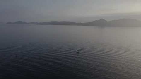 Boat-Cruising-Towards-The-Cies-Islands-Across-The-Atlantic-Ocean-On-A-Misty-Morning-In-Galicia,-Spain