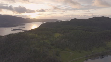 Drone-shot-revealing-an-incredible-Norwegian-landscape-with-fjord-and-forest