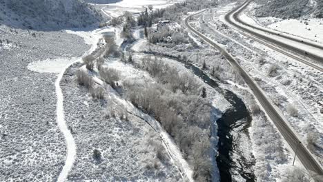 Aerial-footage-tilting-up-along-the-Eagle-River-with-Interstate-70-and-the-Grand-Army-of-the-Republic-Highway