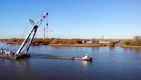 Matador-Floating-Sheerleg-Pulled-By-Tug-Vessel-In-The-Waterway-In-Barendrecht,-Netherlands