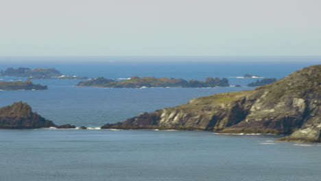 Establishing-view-of-sensational-coastline-in-Dingle,-Ireland,-pan,-sunny-day