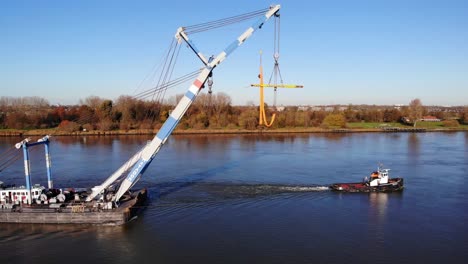 Matador-Floating-Sheerleg-With-Crane-Pulled-By-Tug-Across-The-River-In-Barendrecht,-Netherlands