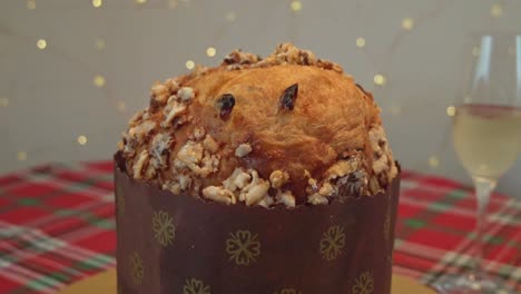 Traditional-Christmas-Italian-Panettone-and-champagne,-zoom-out,-slow-motion