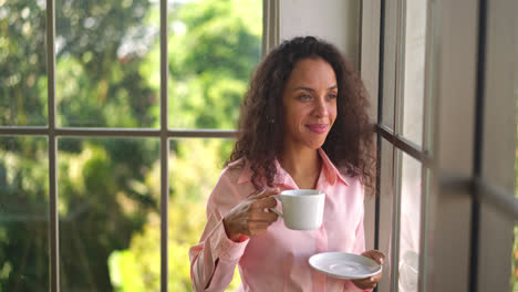 beautiful-latin-woman-drinking-coffee-in-the-morning