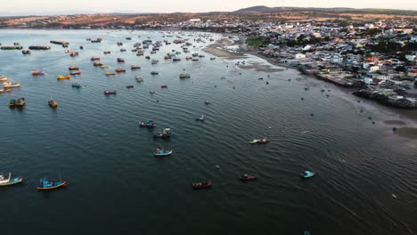 Tens-of-fishermen-boats-are-moored-in-the-Mui-Ne-bay,-Vietnam