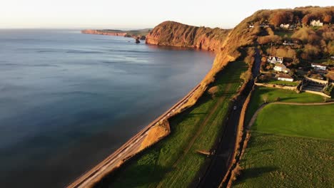Drone-view-of-the-England-seashore-countryside-on-a-peaceful-sunny-late-afternoon