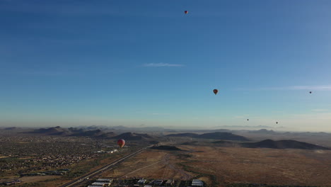 Aerial-drone-view-of-a-hot-air-balloon-launch-in-the-desert
