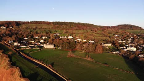 Drone-view-of-the-coastal-landscape-of-the-romantic-English-valley-countryside-at-golden-hour-late-afternoon