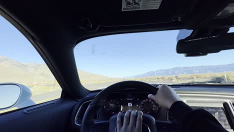 First-person-video-driving-a-luxury-car-on-a-empty-highway