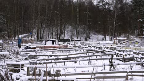 Sustainable-Community-Farm-Garden-In-Snowy-Winter,-Zoom-Out,-Wide