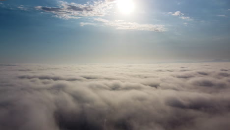 Drone-view-of-a-dreamy-cloudscape-above-the-horizon-line