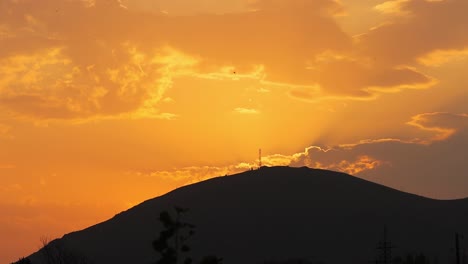Silhouetted-Mountain-With-Orange-Sky-At-Dusk