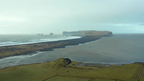 Scenic-view-of-famous-Reynisfjara-black-sand-beach-in-Iceland,-drone-landscape