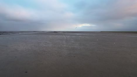 Thick-clouds-over-mudflats-on-Texel-island-are-hanging-heavily