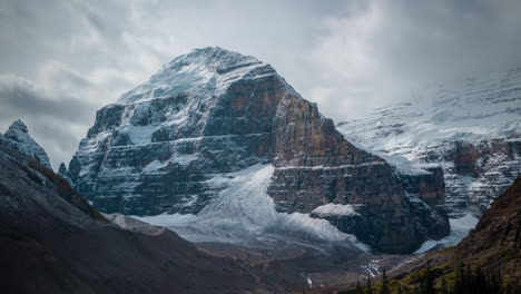 Time-lapse,-cold-freezing-landscape,-clouds-moving-above-rocky-hills-and-glacier-ice